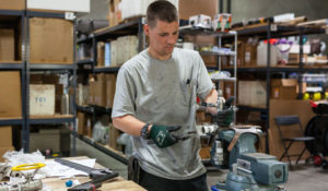 Thermochem employee in the shop working on a tool